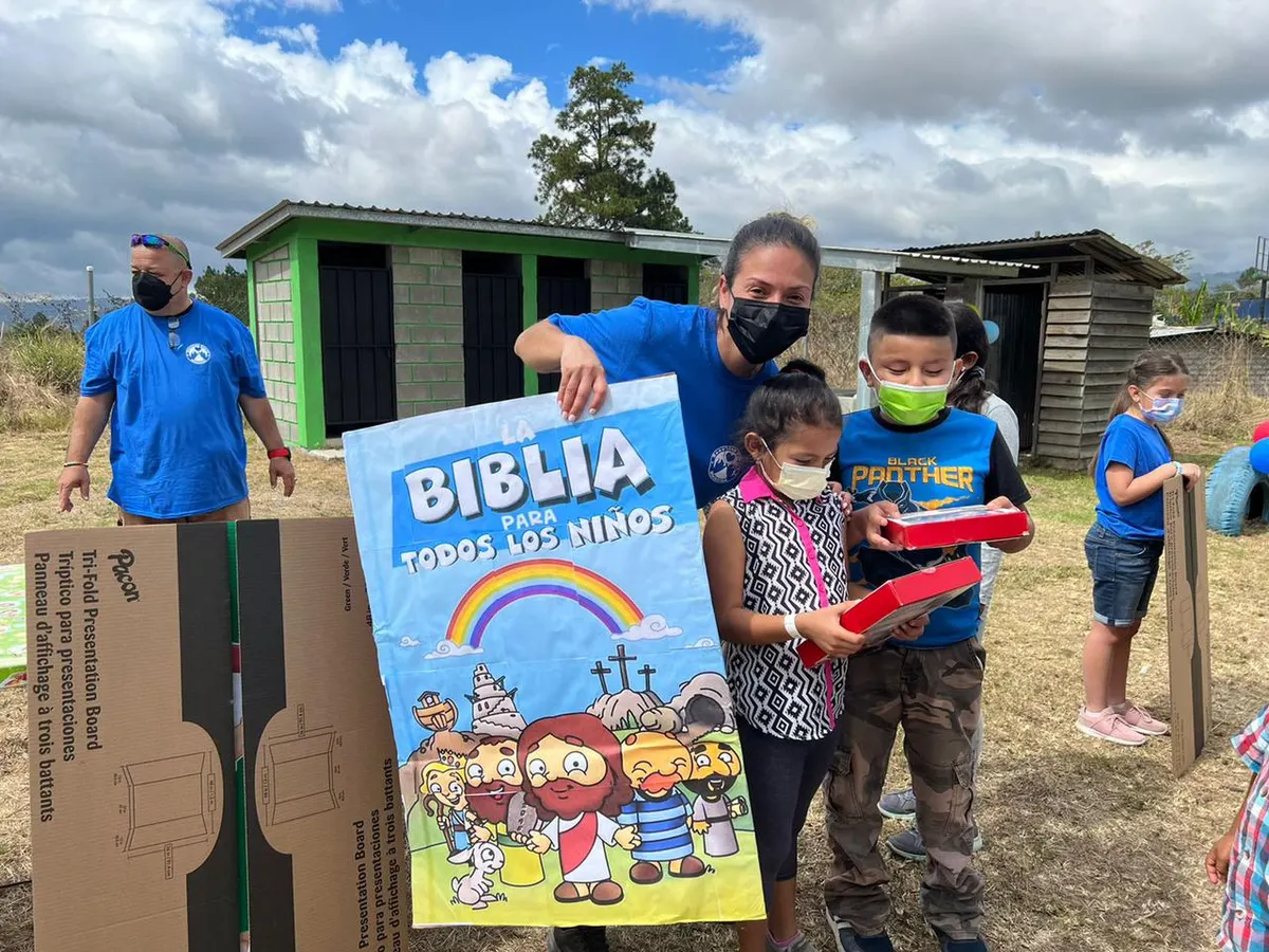 Children receiving Bibles in Honduras